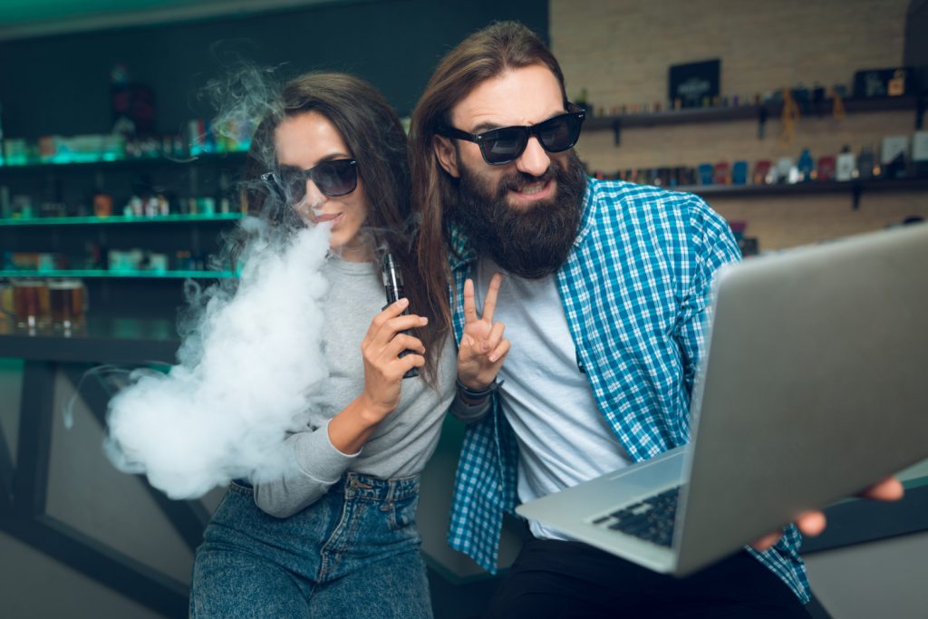 2 people trying their First Vaping Device in the shop